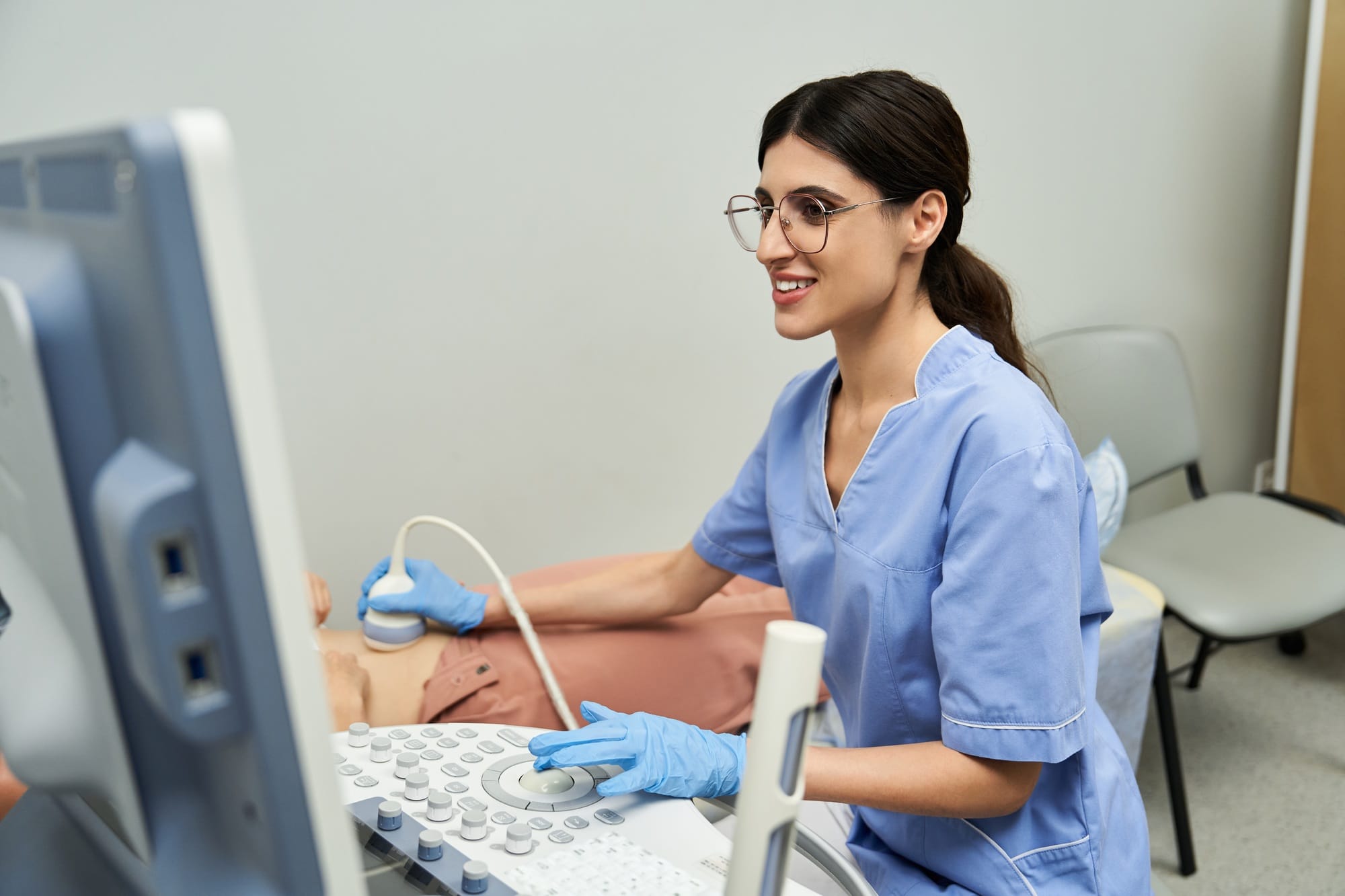 Gynecologist performs ultrasounds for womens health in a modern clinic